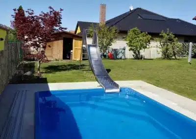 Private water slide in the garden.