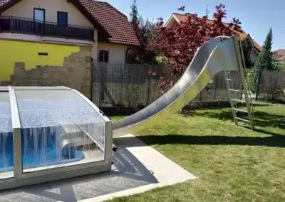Stainless steel pool water slide with roof.