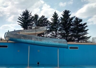 Stainless steel water slide, exit to the pool.