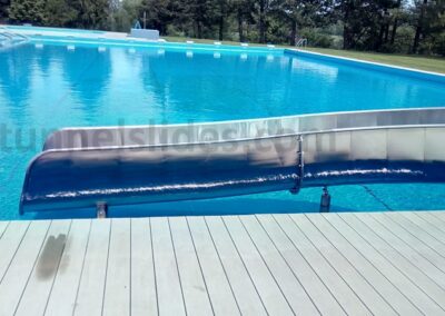 Exit from the stainless steel water slide into the pool.