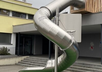 Tunnel stainless steel slide at school.